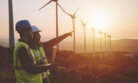 People pointing wind turbines